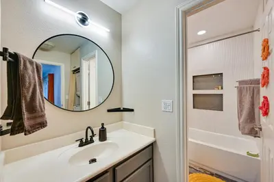 a bathroom with a sink and a mirror at Quiet San Diego Condo with Balcony, Pool and Hot Tub! in San Diego