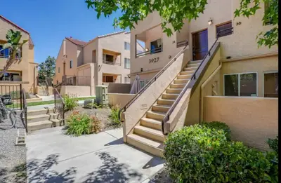 a set of stairs leading to a building at -Vacation-Top corner 2-story one bedroom La Jolla Condo in San Diego