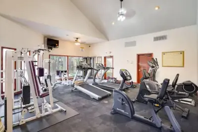a gym with several treadmills and cardio machines at -Vacation-Top corner 2-story one bedroom La Jolla Condo in San Diego