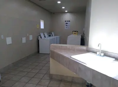 a bathroom with two sinks and two washers at -Vacation-Top corner 2-story one bedroom La Jolla Condo in San Diego