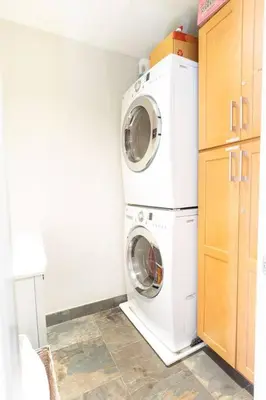 a laundry room with a washer and dryer at Pineapple Paradise - Mission Beach - Stunning in San Diego