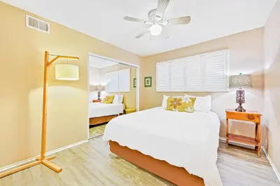 a bedroom with a bed and a ceiling fan at Newport Beach Simplicity III in Newport Beach