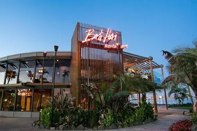 a building with a sign on the side of it at Seaside Point Loma Home with Outdoor Patio in San Diego