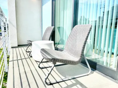 a pair of chairs sitting on a balcony at The Traveler's Getaway in San Diego