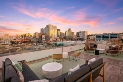 a rooftop patio with a view of a city skyline at The Traveler's Getaway in San Diego