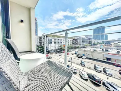 a balcony with chairs and a view of a city at The Traveler's Getaway in San Diego