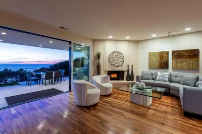 a living room with a couch and a fireplace at Unbeatable Location - Steps to Moonlight Beach in Encinitas