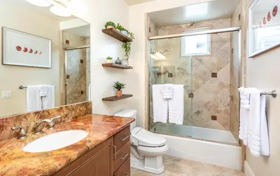 a bathroom with a sink and a shower and a toilet at Stunning Oceanfront Home - Incredible Views in Oceanside