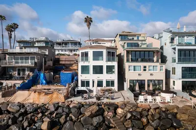 a building under construction next to a group of houses at Stunning Oceanfront Home - Incredible Views in Oceanside