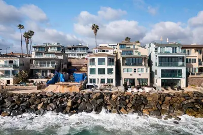 a group of houses next to the water at Stunning Oceanfront Home - Incredible Views in Oceanside