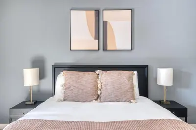 a bedroom with a bed with three pictures on the wall at La Jolla 1br w gym wd pool nr bars shops SAN-8 in San Diego