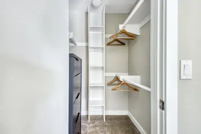 a walk in closet with white walls and shelves at La Jolla 1br w gym wd pool nr bars shops SAN-8 in San Diego