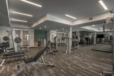 a gym with several treadmills and machines at Mission Valley 1br w gym wd pool nr bars SAN-14 in San Diego