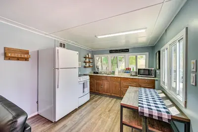 a kitchen with a white refrigerator and a table at Low-Key Poway Home about 20 Mi to La Jolla and San Diego in Poway