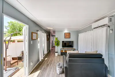 a living room with a couch and a tv at Low-Key Poway Home about 20 Mi to La Jolla and San Diego in Poway