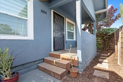 a blue house with stairs leading to a door at NEW Beautiful BOHO Home by Beach, Downtown + Shops in San Diego