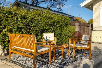 two chairs and a table and a bench on a patio at South Park Charmer - Close to Zoo - Backyard Oasis in San Diego