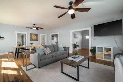 a living room with a couch and a ceiling fan at South Park Charmer - Close to Zoo - Backyard Oasis in San Diego