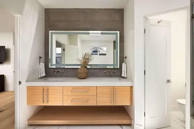 a bathroom with a sink and a mirror at Contemporary Indoor Outdoor Living Walk to Beach in Encinitas