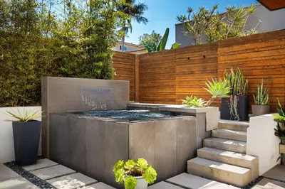 a garden with a fire pit in a backyard at Contemporary Indoor Outdoor Living Walk to Beach in Encinitas