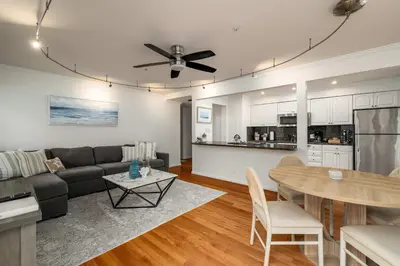 a living room with a couch and a table at REDECORATED - Seaside Dream - Jacuzzi - Patio in San Diego