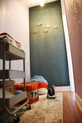 a childs bedroom with a wall with fish on it at Mile to Beach! Private, Family & Pet Friendly Oasis! Pool Table & Hot tub! in Oceanside