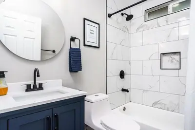 a bathroom with a toilet and a sink and a mirror at Entire 2 Bedroom Pet Friendly Cottage Home in Alpine
