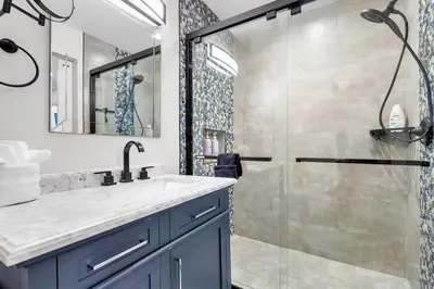 a bathroom with a sink and a shower at Ultimate Oceanside Retreat | Tower 9 Across from the Beach in Oceanside