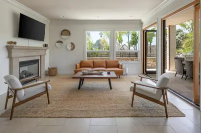 a living room with a couch and a fireplace at Ocean View Del Mar Beach Home w Jacuzzi in San Diego