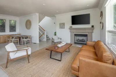 a living room with a couch and a fireplace at Ocean View Del Mar Beach Home w Jacuzzi in San Diego