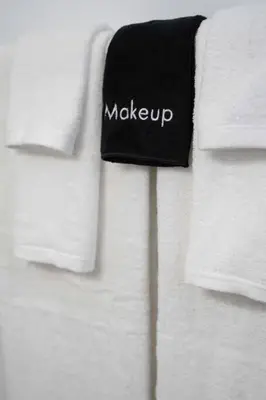 a group of white towels with the word make up on them at Coastal Haven - Prime Spot Walk to Beach in San Diego