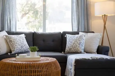 a living room with a couch and a table at Beachside Bliss 2BR with Fast WiFi in San Diego
