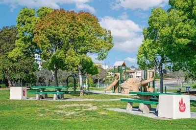 a park with picnic tables and a playground at Remodeled Boho 2 Bed Near Zoo and Downtown in San Diego