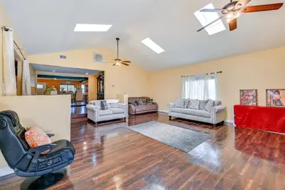 a living room with a chair and a couch at Spring Valley Family Home 13 Mi to San Diego! in Spring Valley