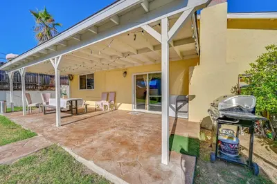 a patio with awning and a table and a grill at Spring Valley Family Home 13 Mi to San Diego! in Spring Valley