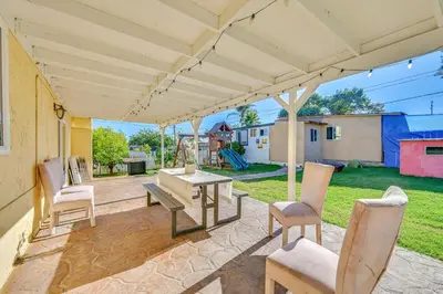 a patio with a table and chairs under a pergola at Spring Valley Family Home 13 Mi to San Diego! in Spring Valley