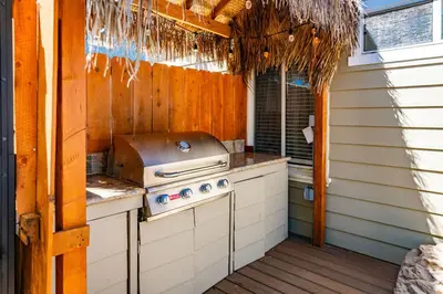 a outdoor kitchen with a stove and a grill at Pacific Beach Bungalow Just Steps to Beach in San Diego