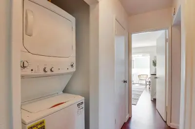 a kitchen with a washer and dryer in a room at Avalon Beach 3 in San Diego