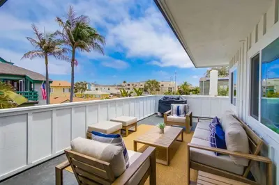 a balcony with furniture and a view of the ocean at Avalon Beach 3 in San Diego