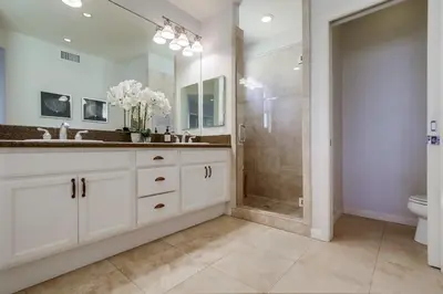 a bathroom with a shower and a sink and a toilet at Aloha Breeze 2 in San Diego