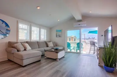 a living room with a couch and a table at Bayside Cove 2 in San Diego