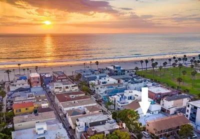 an aerial view of a beach with buildings and the ocean at Beach & Bay in San Diego