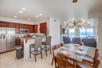 a kitchen and dining room with a table and chairs at Beach Break 2 in San Diego