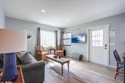 a living room with a couch and a table at Beachy Keen 2 in San Diego
