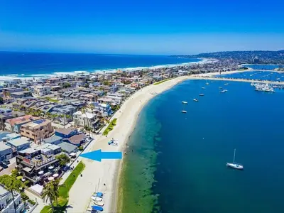 an aerial view of a beach with boats in the water at Boardwalk 2 in San Diego