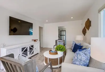a living room with a couch and a table at Boardwalk 2 in San Diego