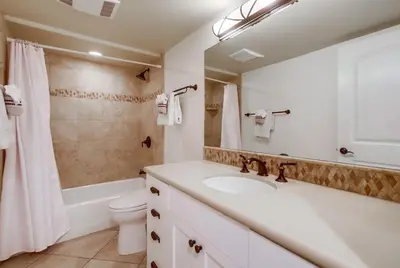 a bathroom with a sink and a toilet and a shower at Ocean Style in San Diego