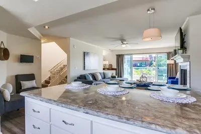 a kitchen and living room with a large counter top at Pacific Shores in San Diego