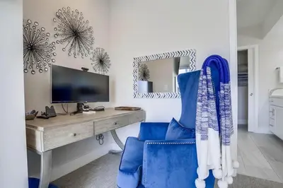 a room with a desk and a blue chair at CA Dreaming in San Diego