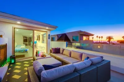 a living room with a couch and a house at CA Dreaming in San Diego